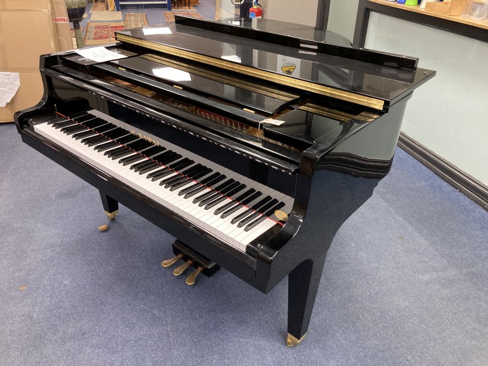 A Kawai baby grand piano, in a bright polyester finish case, on square tapered legs, together with matching adjustable stool